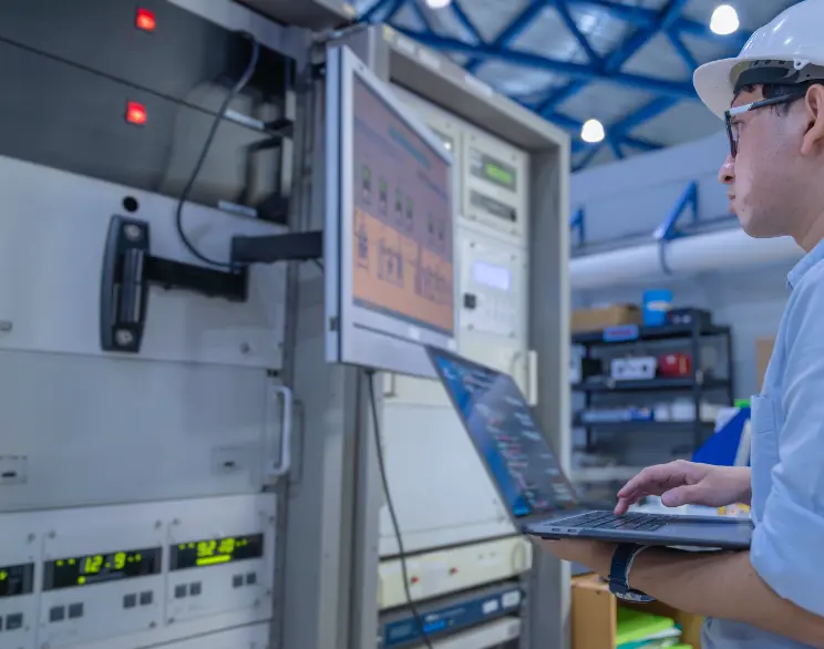 Electrical engineer performing preventive maintenance inspection